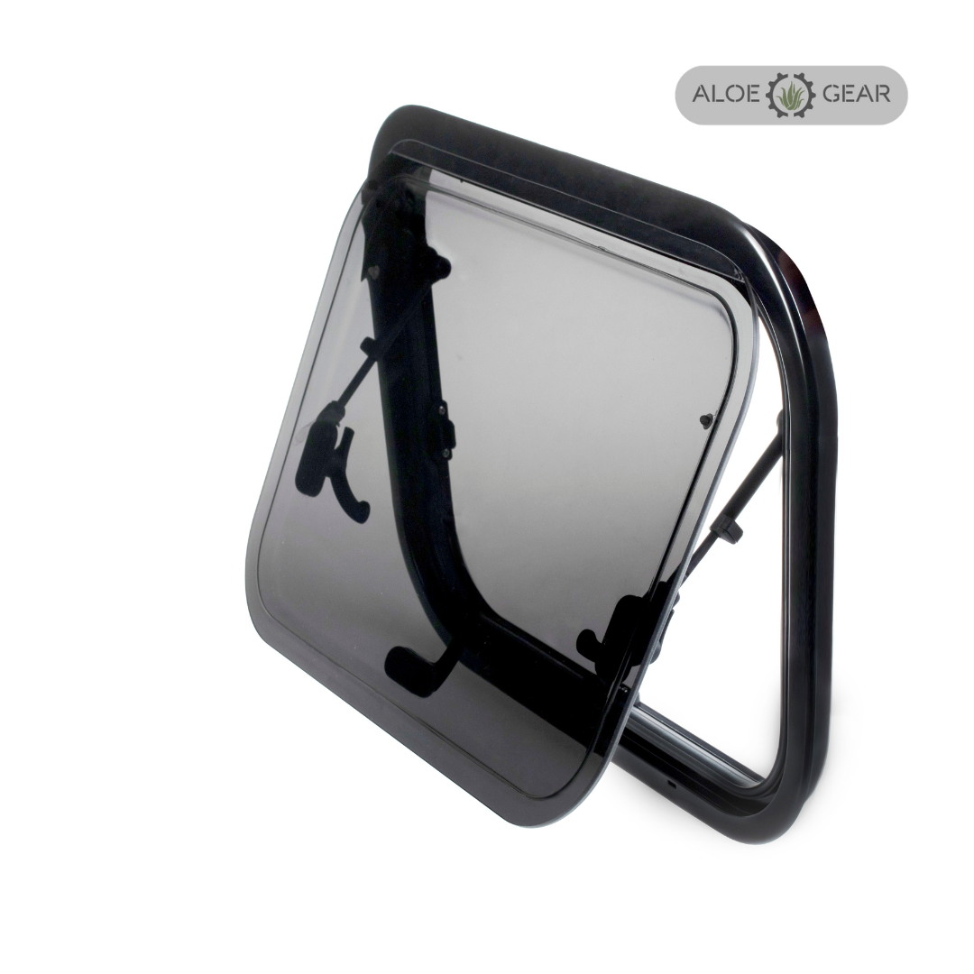 Motorhome or caravan window with black frame and clear flap on a white background, branded 'Aloe Gear'.