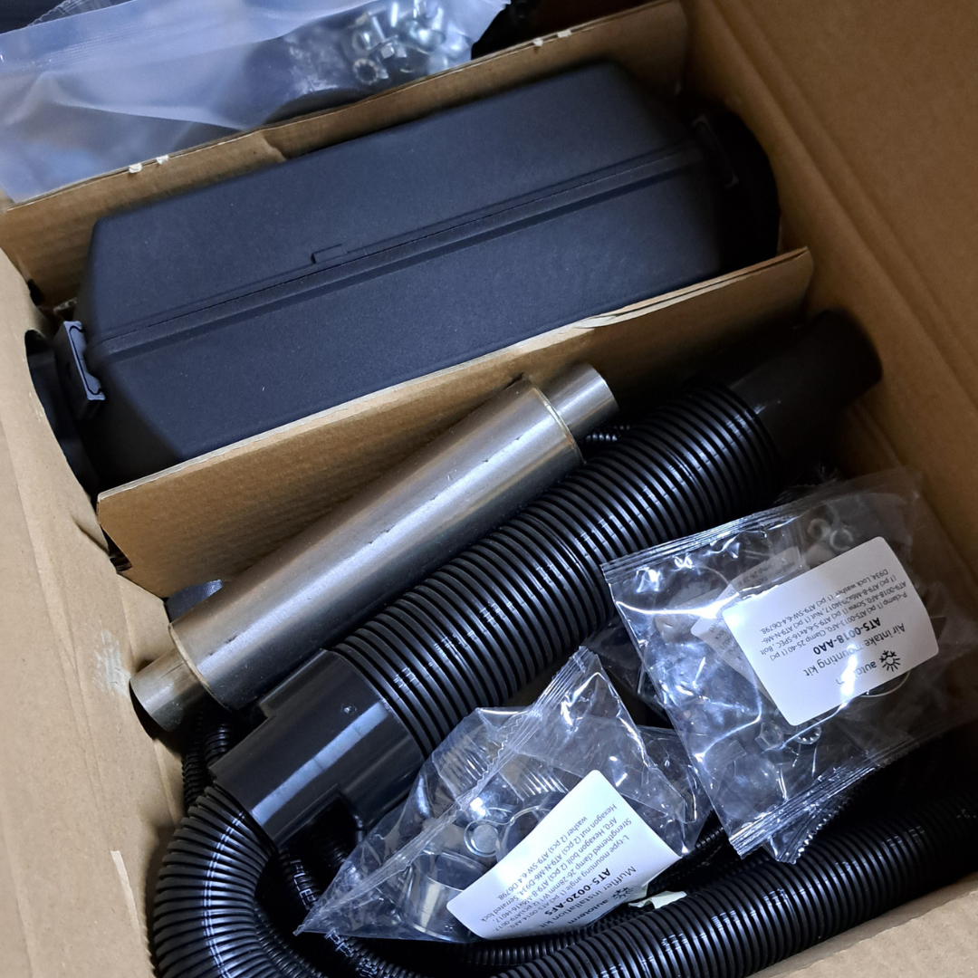 Air Heater parts in a cardboard box.