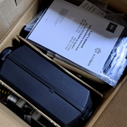 Product packaging with a blue case and User's manual inside a cardboard box.
